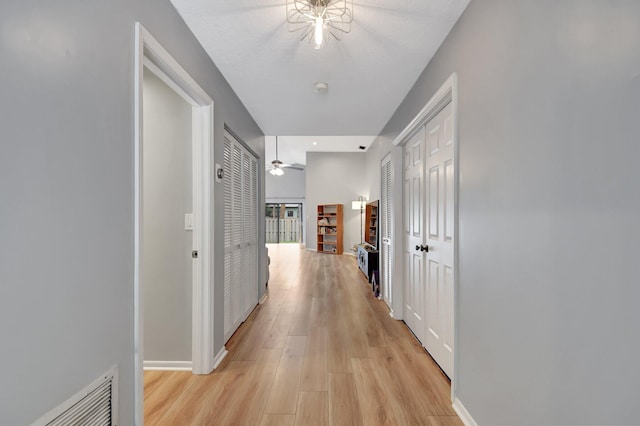 hall with light hardwood / wood-style flooring