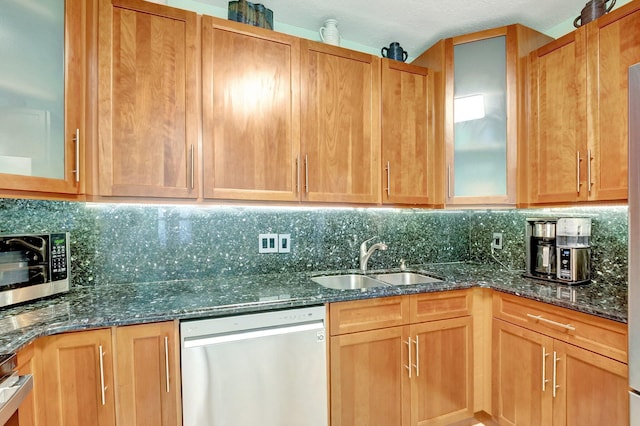 kitchen featuring sink, appliances with stainless steel finishes, and tasteful backsplash