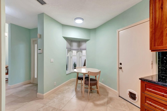 view of tiled dining room