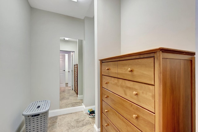 hallway featuring light tile patterned floors