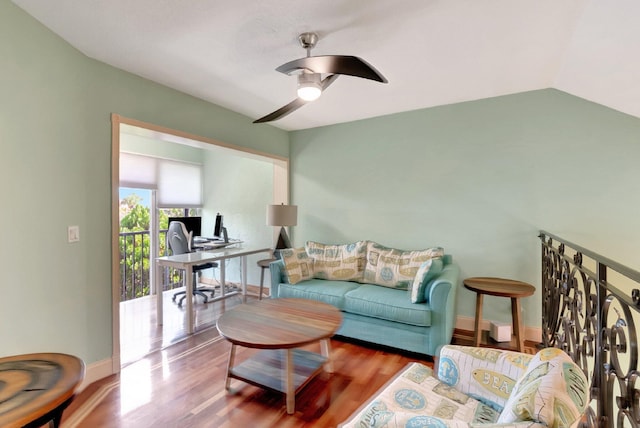 living room with ceiling fan, wood-type flooring, and vaulted ceiling