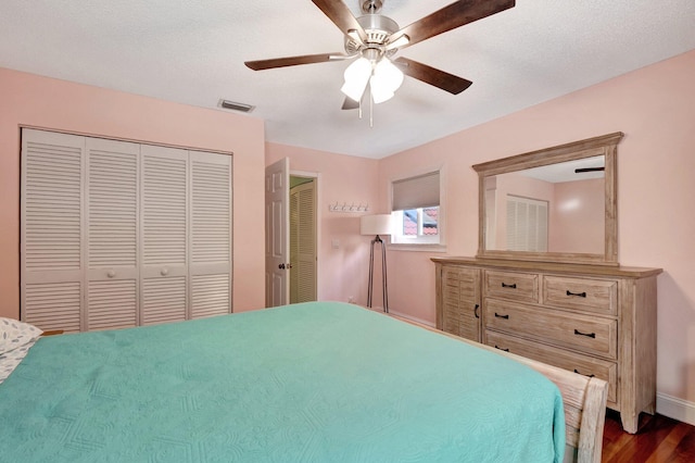 bedroom with ceiling fan and dark hardwood / wood-style flooring