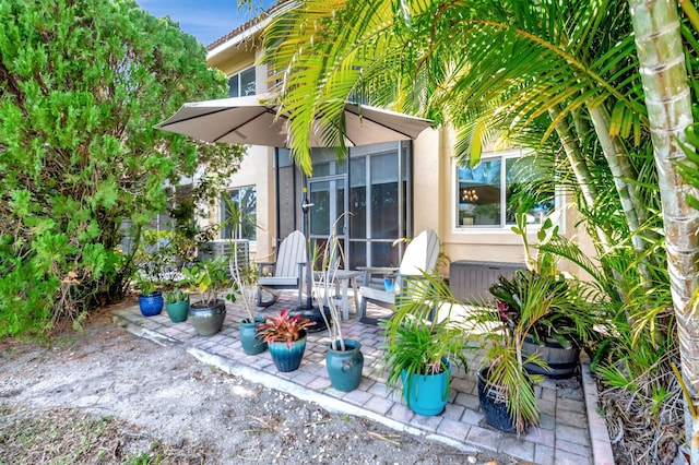 view of patio / terrace with a sunroom