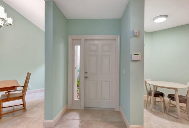 entryway with light tile patterned floors