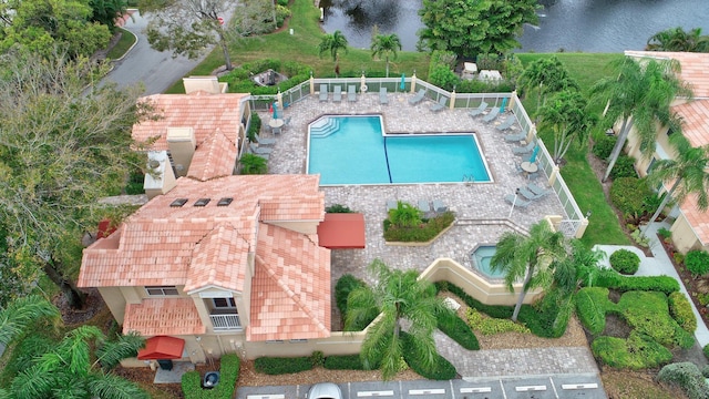 view of swimming pool featuring a water view