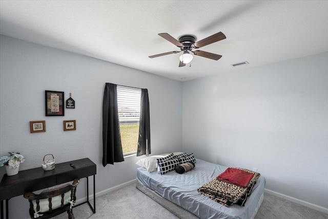 carpeted bedroom with ceiling fan