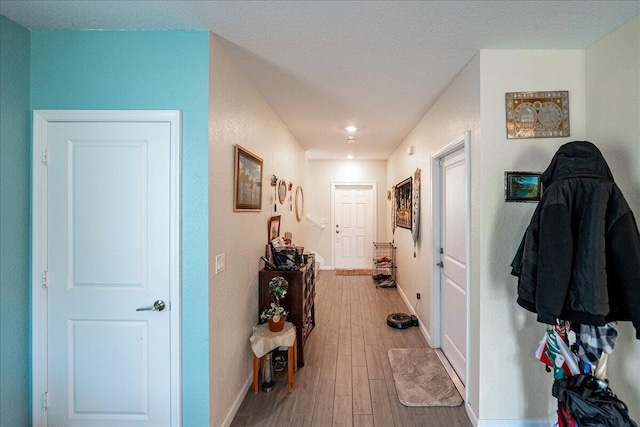 corridor featuring hardwood / wood-style floors