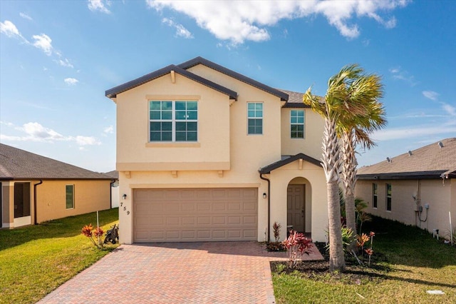 view of front of house featuring a front lawn and a garage