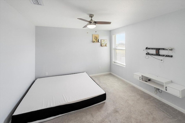 unfurnished bedroom with carpet and ceiling fan