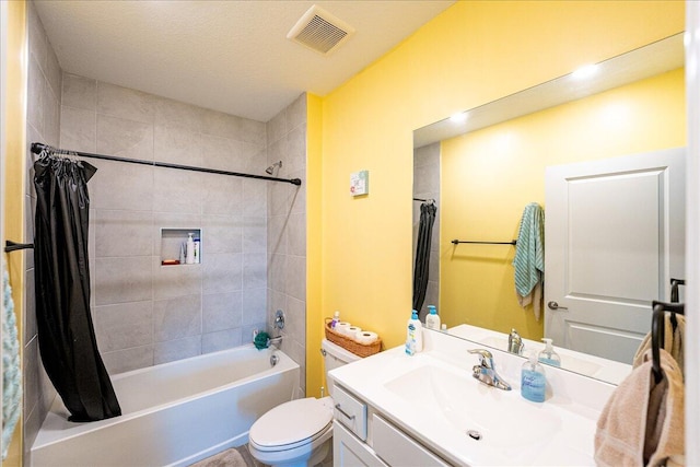 full bathroom with shower / tub combo with curtain, vanity, and toilet