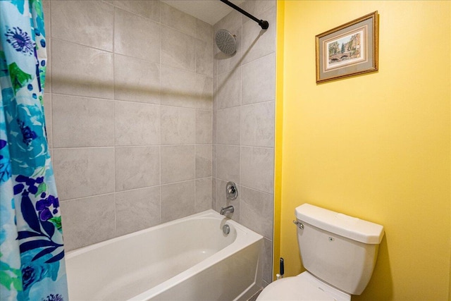 bathroom with toilet and shower / tub combo with curtain