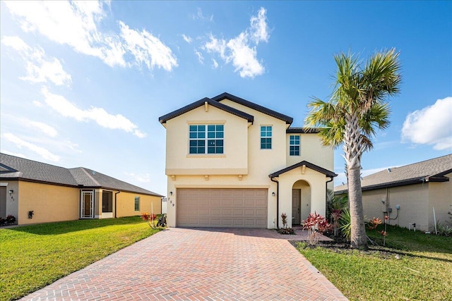 view of front facade with a front yard and a garage