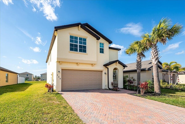 view of front facade with a garage and a front yard