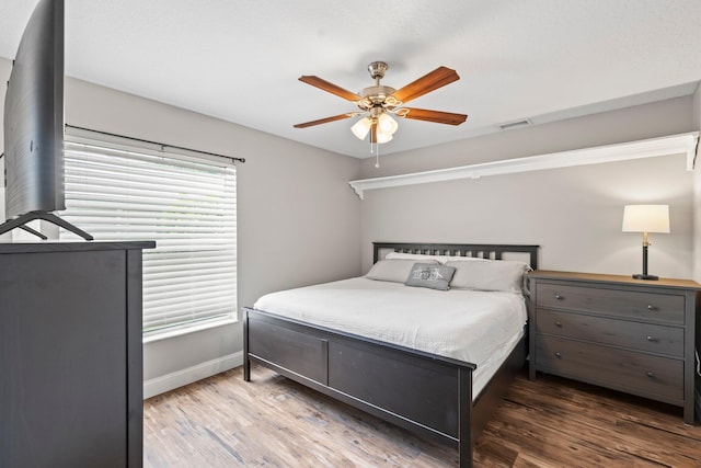 bedroom featuring ceiling fan and wood-type flooring