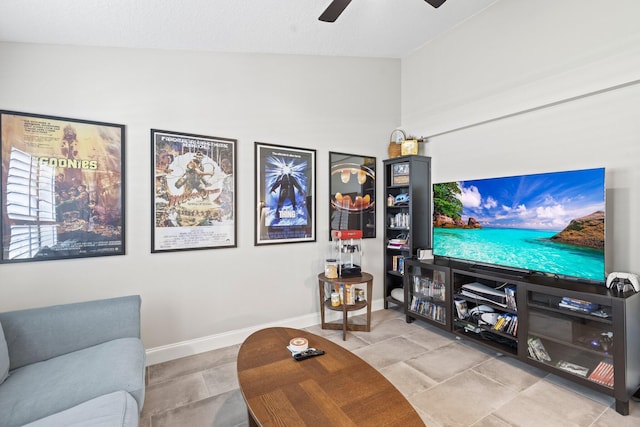 tiled living room with ceiling fan