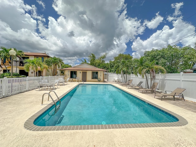 view of swimming pool featuring a patio