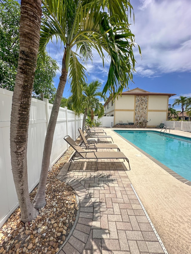 view of swimming pool featuring a patio area