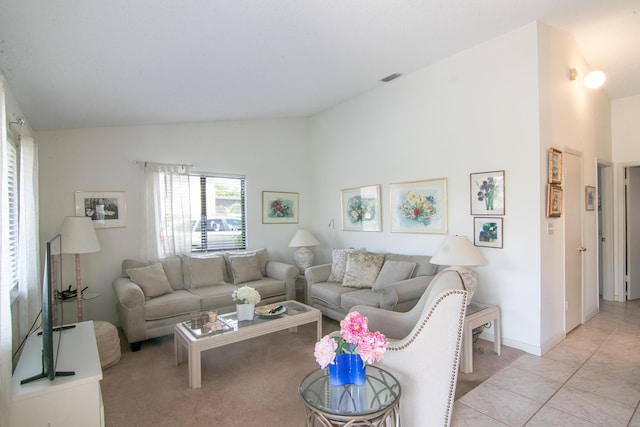 living room featuring light tile patterned floors and lofted ceiling