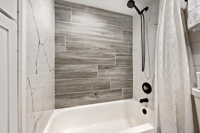 bathroom featuring shower / tub combo with curtain