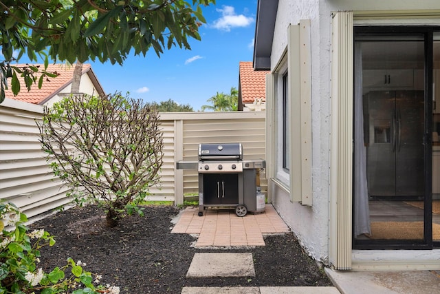 view of patio / terrace featuring a grill