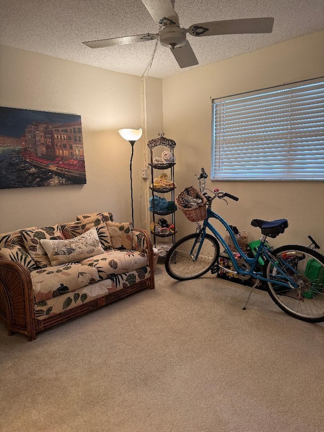 living room with carpet flooring and a textured ceiling