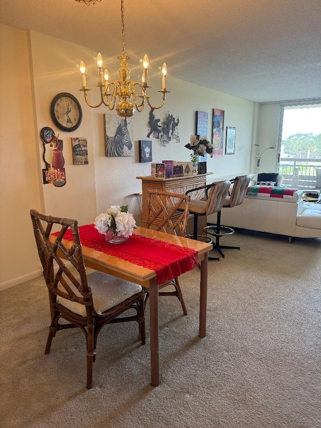 carpeted dining area featuring a textured ceiling and an inviting chandelier