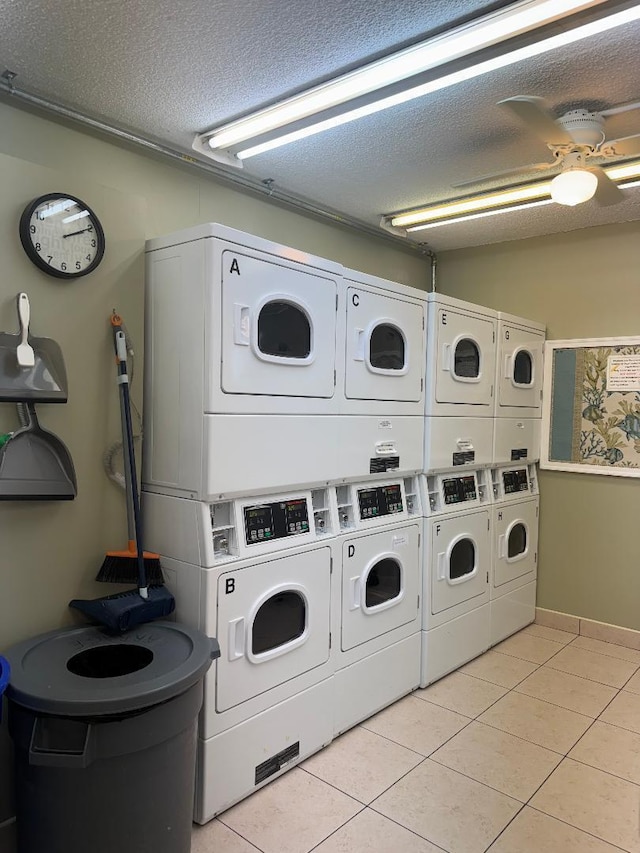 laundry room featuring light tile patterned flooring, washing machine and dryer, and stacked washer and dryer