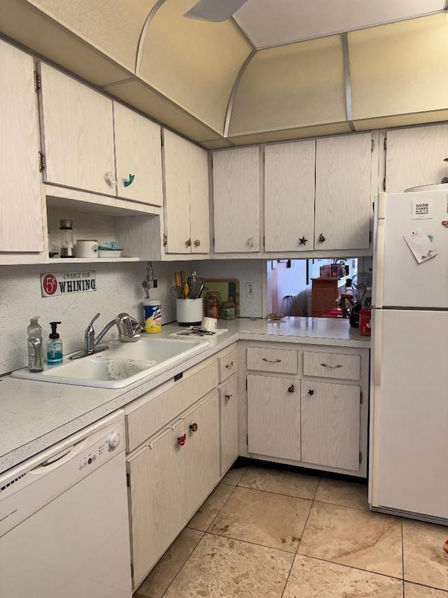 kitchen with white appliances and sink