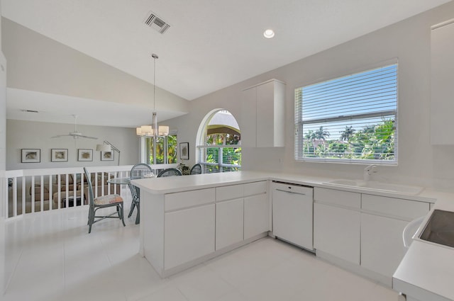 kitchen featuring white cabinetry, sink, kitchen peninsula, white dishwasher, and vaulted ceiling