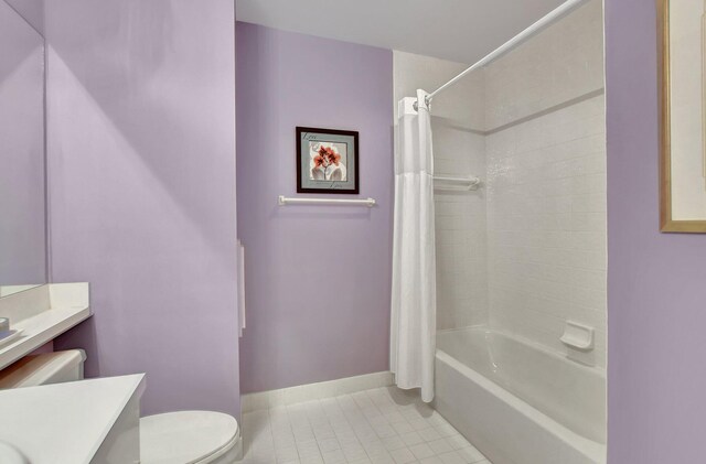 full bathroom featuring tile patterned flooring, vanity, toilet, and shower / tub combo