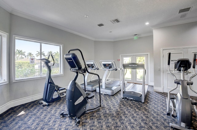 exercise room featuring ornamental molding, a textured ceiling, and french doors