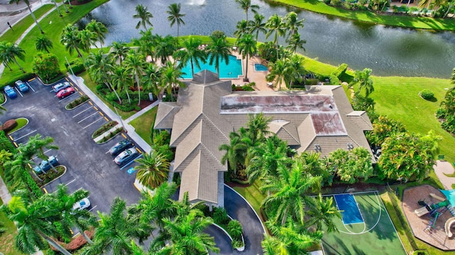 birds eye view of property with a water view