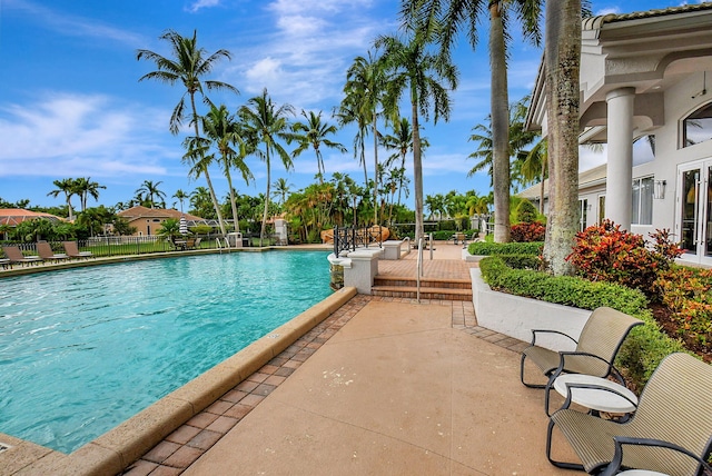 view of swimming pool featuring a patio area