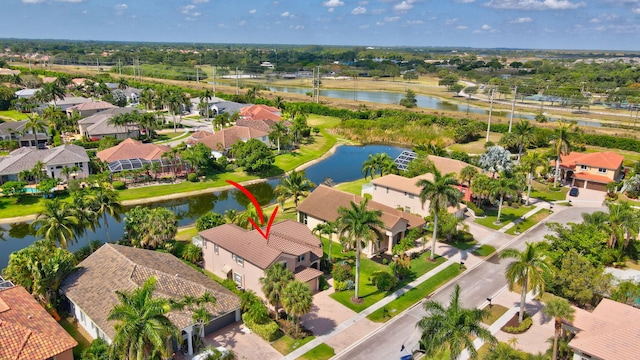 birds eye view of property featuring a water view