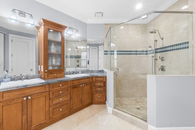 bathroom featuring tile patterned flooring, vanity, a shower with door, and crown molding