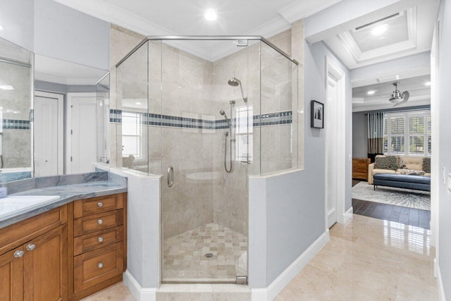 bathroom with vanity, a shower with door, and ornamental molding