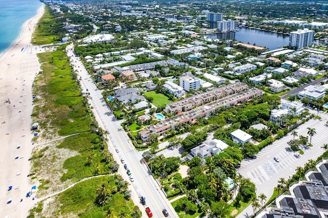 birds eye view of property featuring a water view and a view of the beach