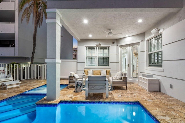 view of pool featuring ceiling fan