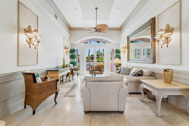 interior space with french doors, a tray ceiling, light tile patterned floors, and ceiling fan