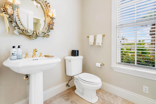 bathroom featuring tile patterned flooring and toilet