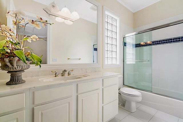 full bathroom featuring tile patterned floors, toilet, plenty of natural light, and combined bath / shower with glass door