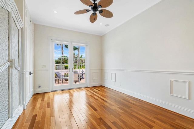 empty room with light hardwood / wood-style floors and ceiling fan