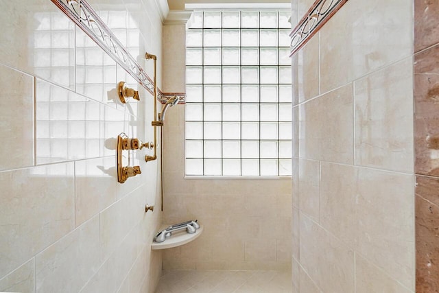 bathroom with tiled shower