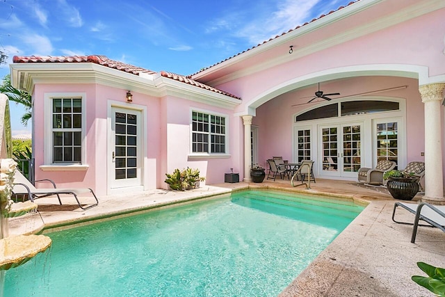 view of swimming pool featuring a patio area and ceiling fan