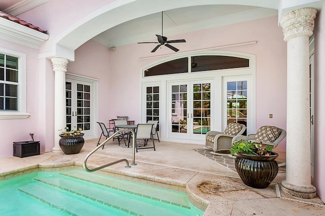 view of swimming pool featuring french doors, a patio, and ceiling fan