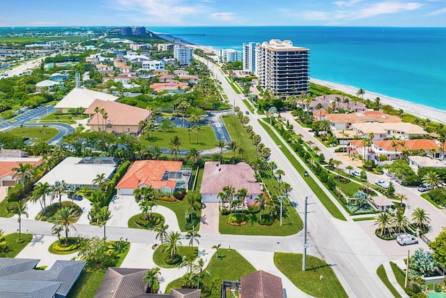 aerial view featuring a water view and a beach view