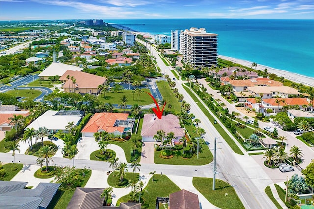 aerial view with a water view and a view of the beach