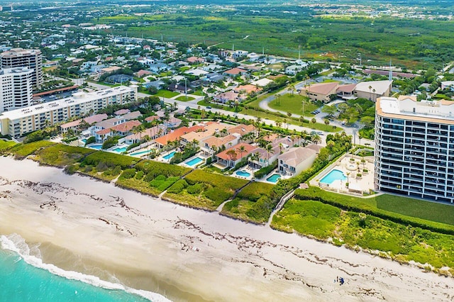 aerial view with a water view and a view of the beach