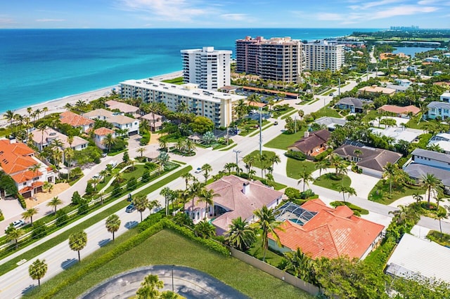 birds eye view of property featuring a water view and a view of the beach