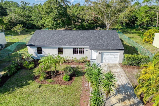 exterior space with a garage and a front lawn